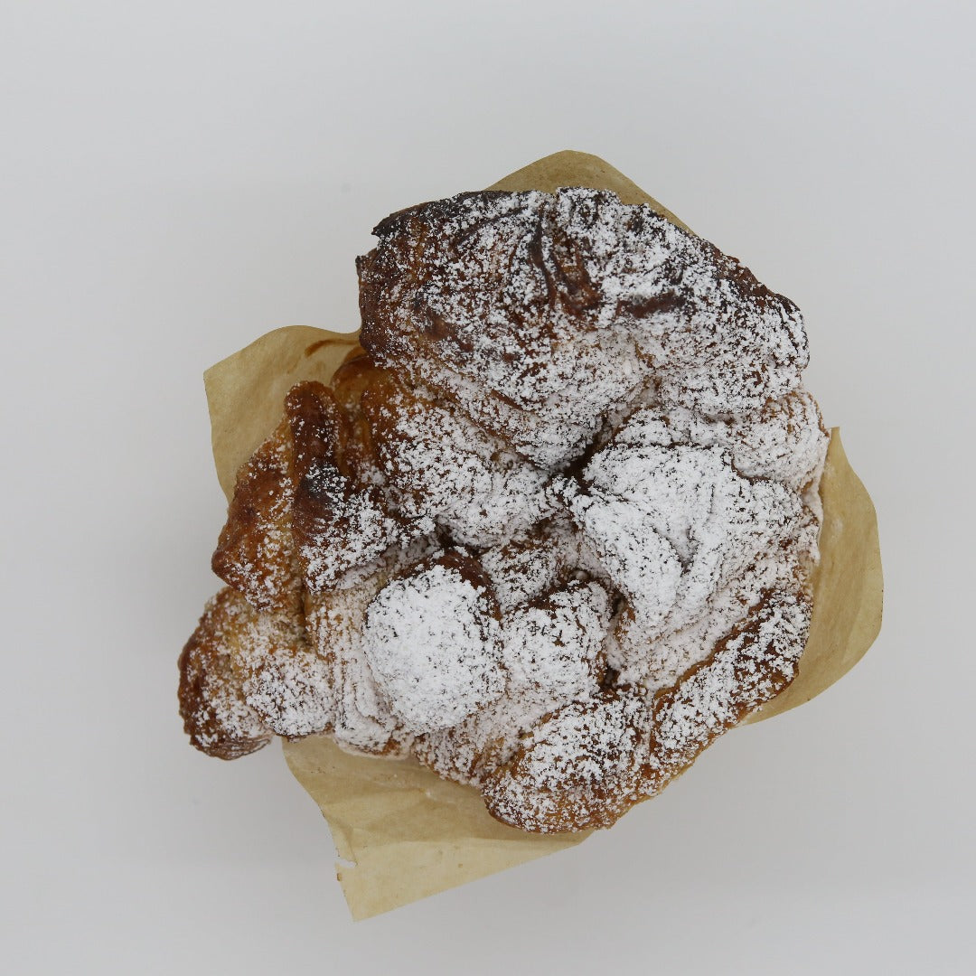 Cinnamon Sugar Monkey bread sitting on a white background.