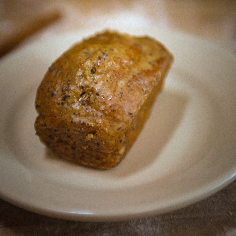 Earl Grey Tea Cake on a plate in a bakery.