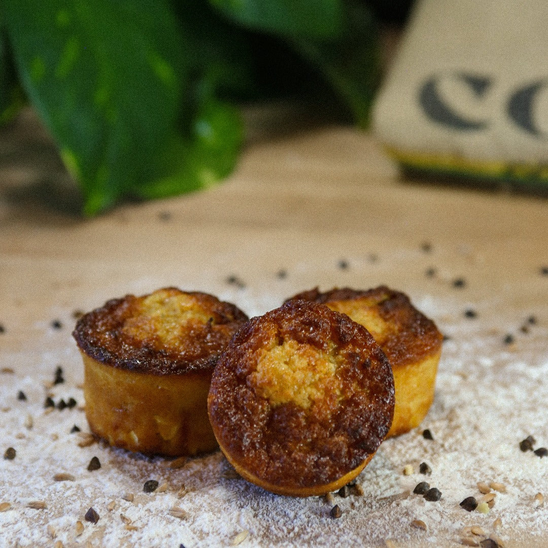 Three Anaheim Corn Cakes on a bakers bench with flour.