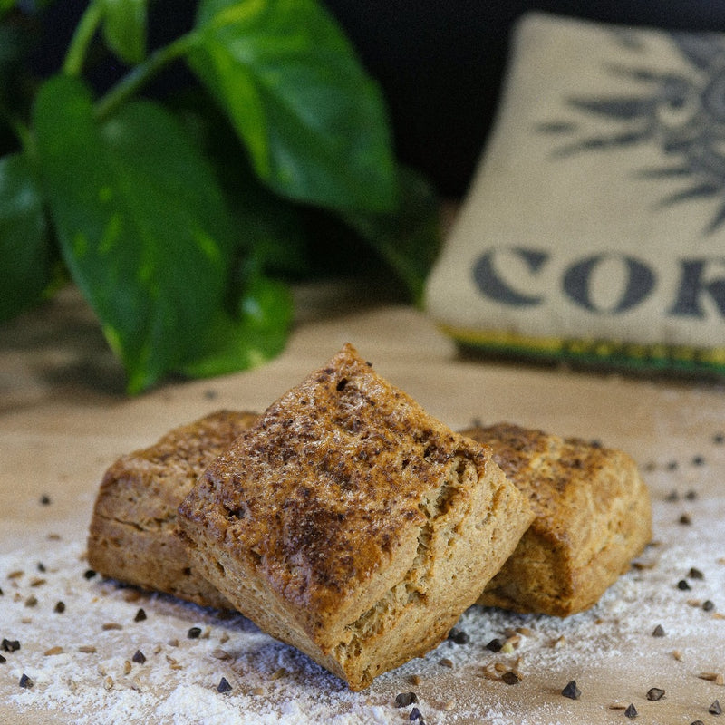 Lemon Curd and Strawberry Pepper Jam on a baker's bench with flour